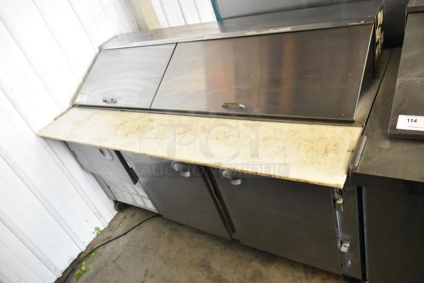 Hudson stainless steel sandwich salad prep table, mega top, bain marie on casters. Features include dual sliding doors and sturdy construction. Runs on 115 volts, 1 phase. Visible wear on surface.