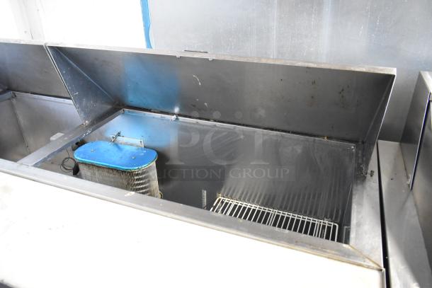 Hudson stainless steel sandwich prep table, mega top design, on casters. Features bain marie and wire shelving, 115V, 1 phase.
