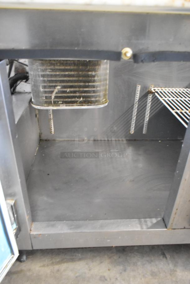 Hudson stainless steel commercial sandwich salad prep table with Bain Marie top, on commercial casters. 115 volts, 1 phase.