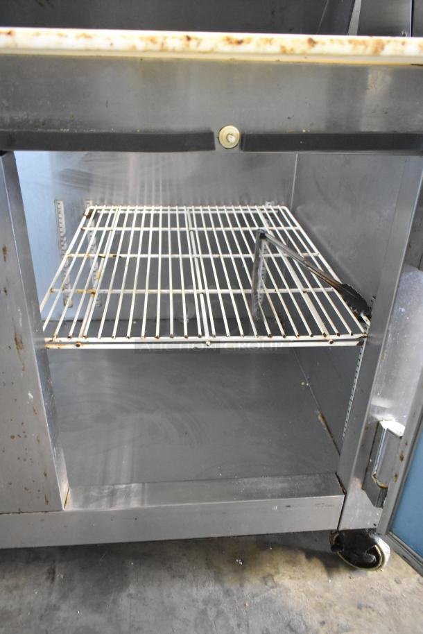 Hudson stainless steel commercial prep table with Bain Marie mega top, visible rust, on commercial casters. 115 Volts, 1 Phase.