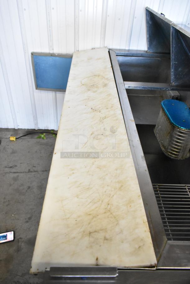 Hudson stainless steel prep table with bain marie top, commercial casters, 115 volts, 1 phase. Visible surface wear.