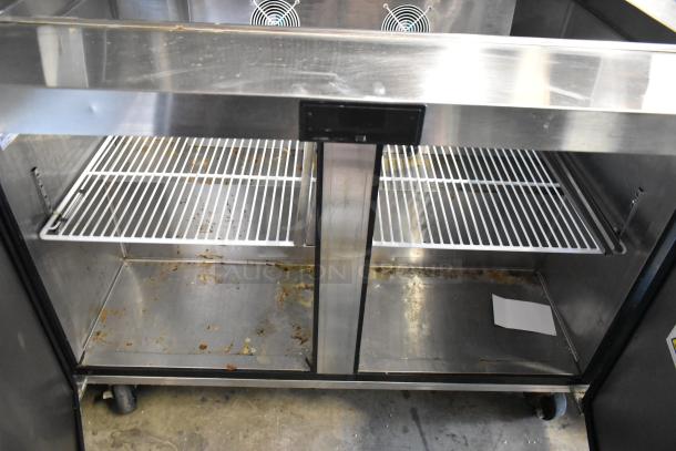 2020 Atosa MSF8308GR stainless steel prep table, dual shelves, visible wear, on commercial casters. Model MSF8308GR.
