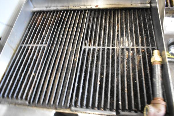2021 CPG 351CRCPG24NL stainless steel charbroiler grill, natural gas, 80,000 BTU, visible signs of use on grates.