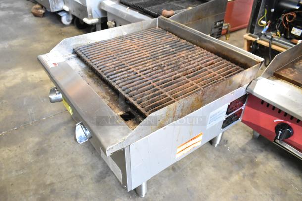 Qualite QLEC-24/NG stainless steel charbroiler grill, 60,000 BTU, natural gas, countertop, visible wear, dual control knobs.