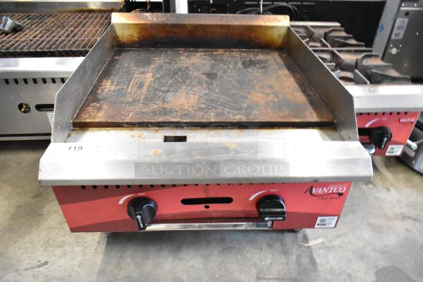 2024 Avantco 177CAG24MG stainless steel commercial flat top griddle, natural gas powered, lightly worn surface, dual controls.