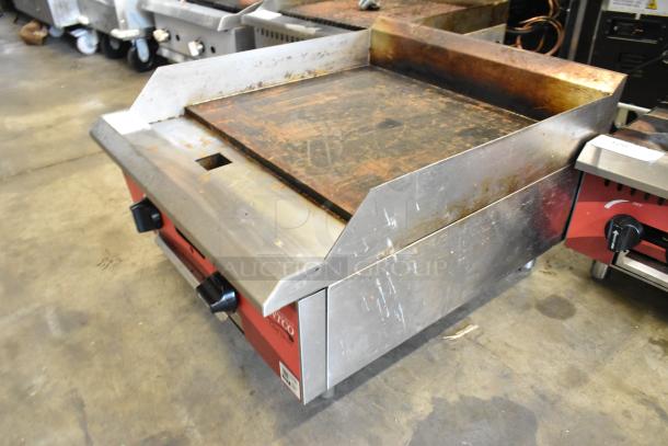 2024 Avantco 177CAG24MG stainless steel griddle, natural gas powered, countertop model, shows wear and rust, two control knobs.