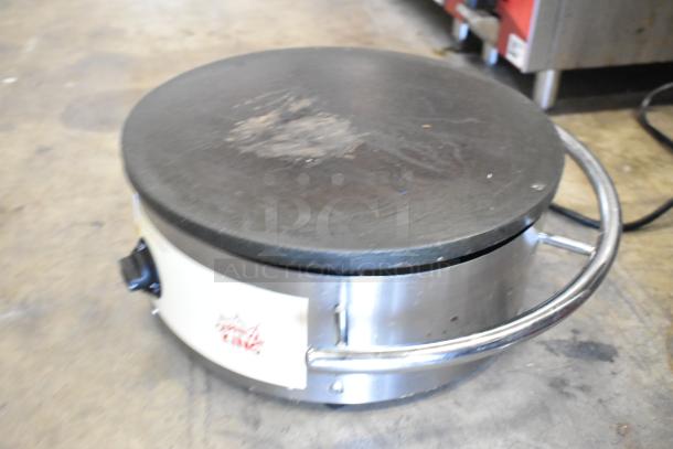 Carnival King 382TCMPT16A crepe maker in stainless steel. Features a smooth circular cooking surface. Used condition.