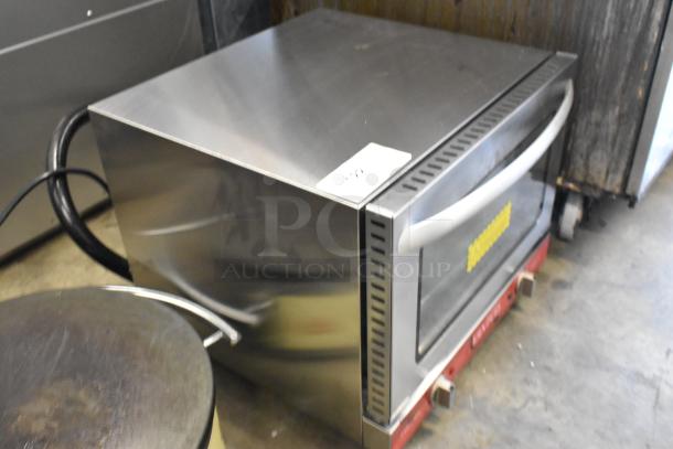 Avantco 177CO14 stainless steel countertop electric convection oven, quarter size, shown in used condition. 120 Volts, 1 Phase.
