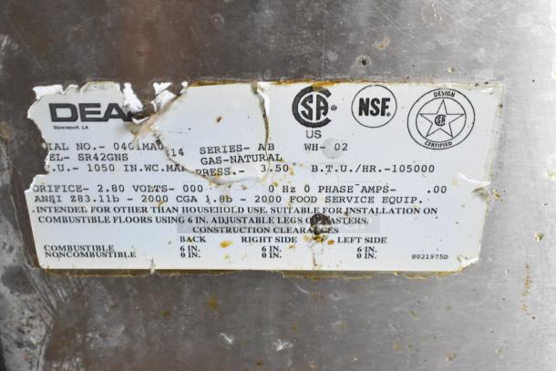 Dean SR42GNS stainless steel natural gas fryer; 105,000 BTU. Label shows model, specifications, and usage guidelines.