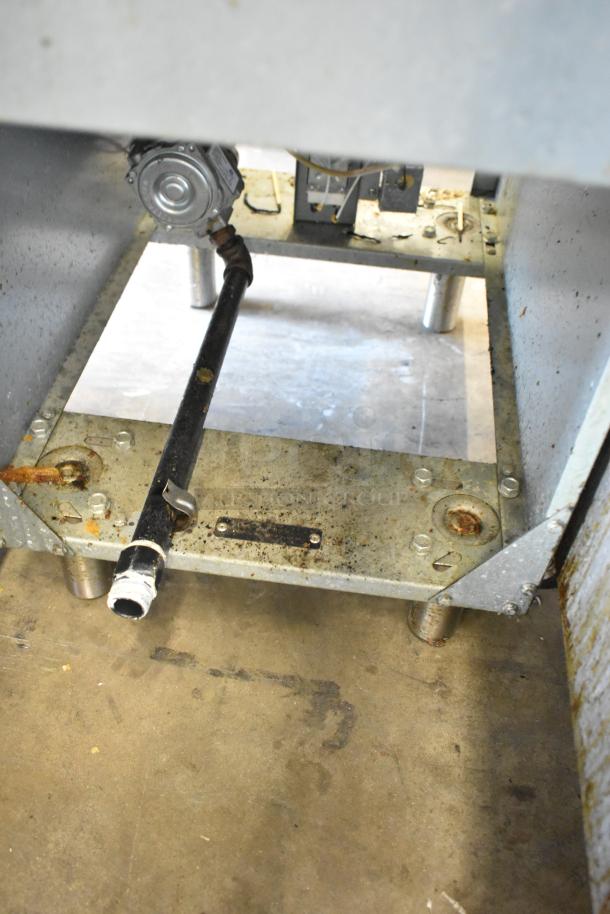 Stainless steel Avantco FF300-N natural gas deep fat fryer base, visible wear, 90,000 BTU, commercial use.