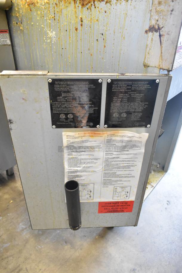 Qualite GF-90/NG stainless steel natural gas fryer, with visible grease, instructions, and safety labels; 90,000 BTU.