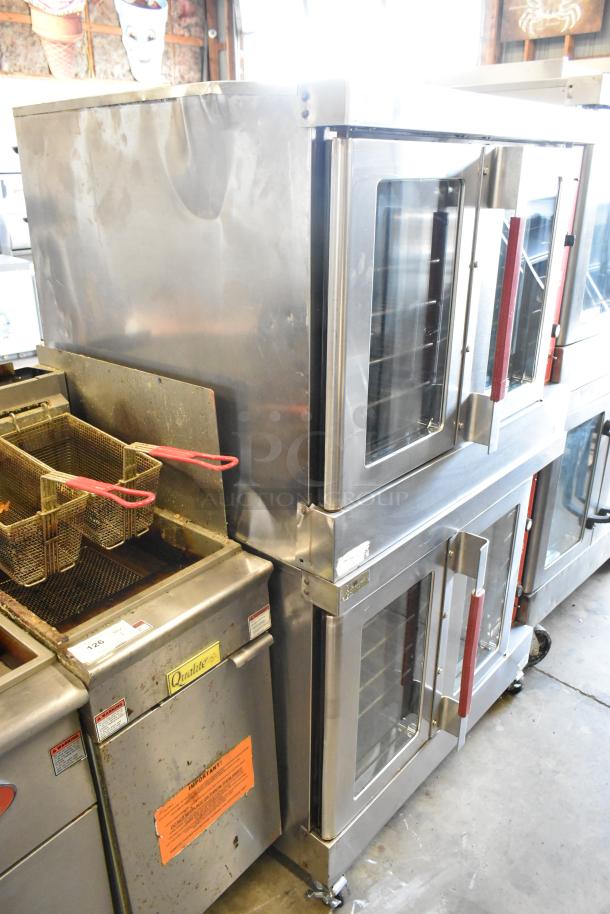 Vulcan VC6GD-SEFCAM stainless steel full-size convection ovens with view-through doors, metal racks, on casters.