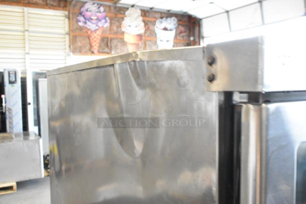 2 Vulcan VC6GD-SEFCAM stainless steel convection ovens, view-through doors, on casters, slight dent on side visible.