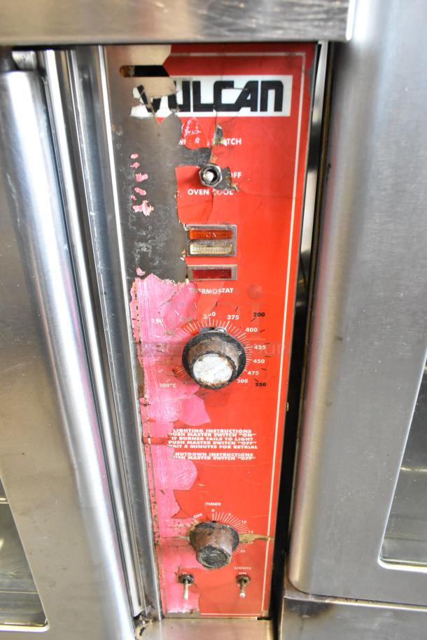 Vulcan VC6GD-SEFCAM commercial convection oven controls; visible wear, rust on knobs, clear view through doors.