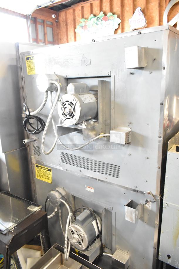 Stainless steel Vulcan VC6GD-SEFCAM commercial convection oven, view-through doors, metal racks, thermostatic controls, on casters.