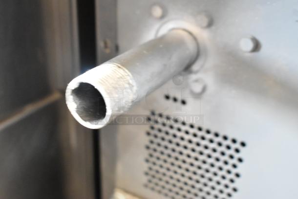 Close-up of a metallic pipe and vent on a Vulcan VC6GD-SEFCAM convection oven, highlighting industrial features.