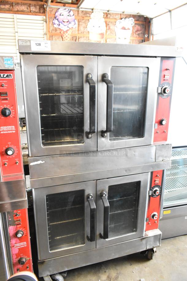Vulcan stainless steel commercial convection oven with view-through doors, metal racks, thermostatic controls, and casters.