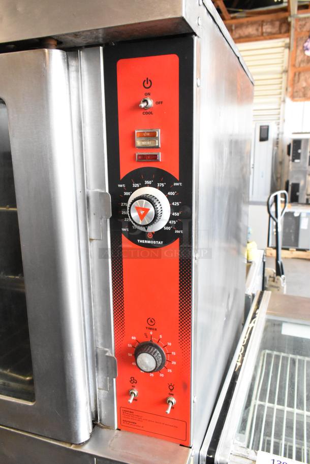 Vulcan stainless steel commercial convection oven with view-through doors, metal racks, thermostatic controls, and casters.