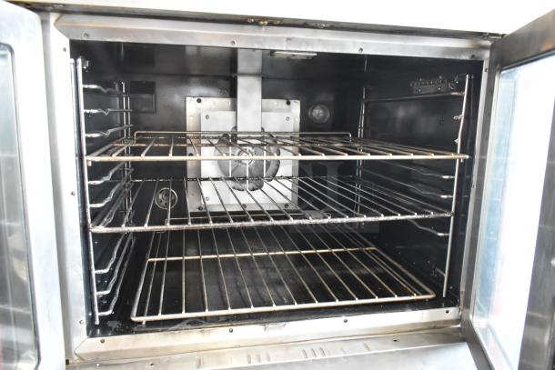 Vulcan stainless steel commercial convection oven interior with metal racks, view-through doors, and thermostatic controls.