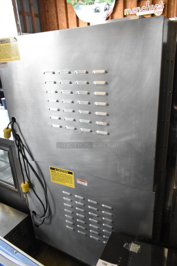Vulcan stainless steel commercial convection oven, view-through doors, metal racks, thermostatic controls, on casters.
