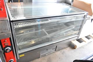 Stainless steel deli display case with glass front, white wire racks, and control panel. 115 volts, 1 phase.