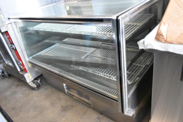 Stainless Steel Commercial Deli Display Case, floor style, 115 volts, 1 phase, glass front, multiple shelves, used condition.