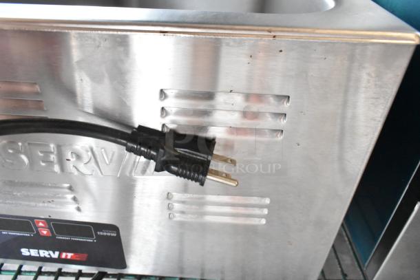 Brand new ServIt 423FW150 electric countertop food warmer, 12" x 20", digital controls, 120V, scratch and dent condition.