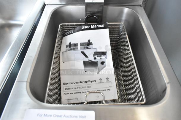 Brand new 2024 Avantco 177F200 electric countertop fryer with metal lid, fry basket, and user manual. 15 lb. capacity.