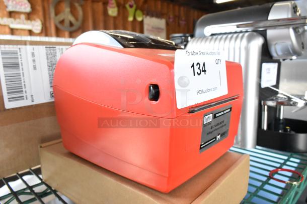 Red DayMark MATT85 thermal label printer, brand new with minor scratches. Includes original markings and auction label.