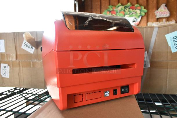 BRAND NEW DayMark MATT85 thermal label printer in red. Slight cosmetic scratches. Features power switch and USB port.