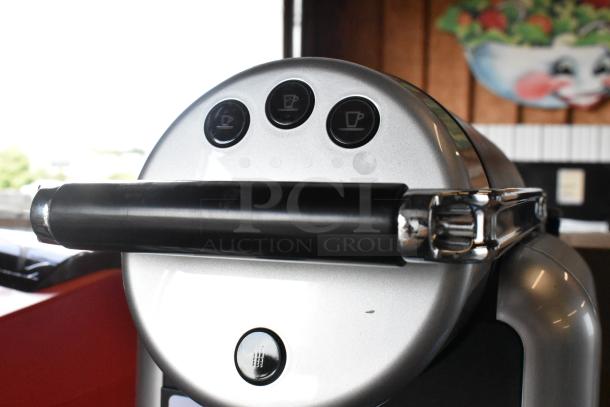 BRAND NEW SCRATCH AND DENT Nespresso Zenius single-serve espresso machine, 120 Volts, minor surface imperfections visible.