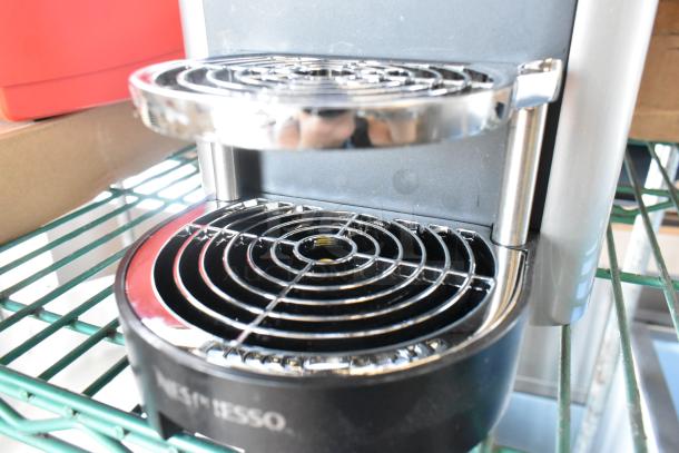 BRAND NEW Nespresso Zenius Single-Serve Espresso Machine, 120V, 1 Phase. Scratch and dent condition showing drip tray.