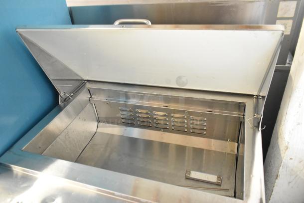 2023 Coldline SP-27 stainless steel prep table, mega top, open lid showing clean interior, commercial casters, 115V.