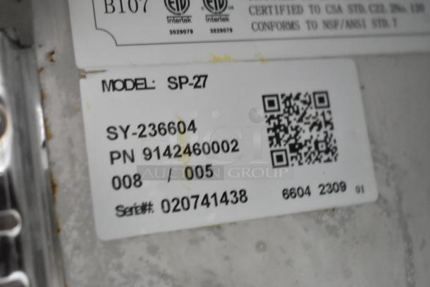 Label on 2023 Coldline SP-27 sandwich salad prep table showing model, serial number 020741438, and QR code.
