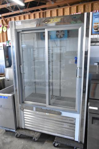 Universal Coolers metal 2-door reach-in cooler merchandiser, 115 volts, 1 phase. Clean glass doors, visible fan units.