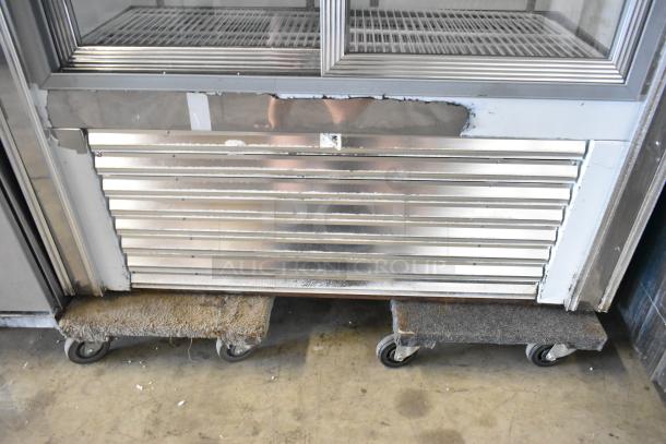 Universal Coolers 2 Door Metal Cooler Merchandiser. Commercial use, 115V, 1 Phase. Visible wear on bottom panel.