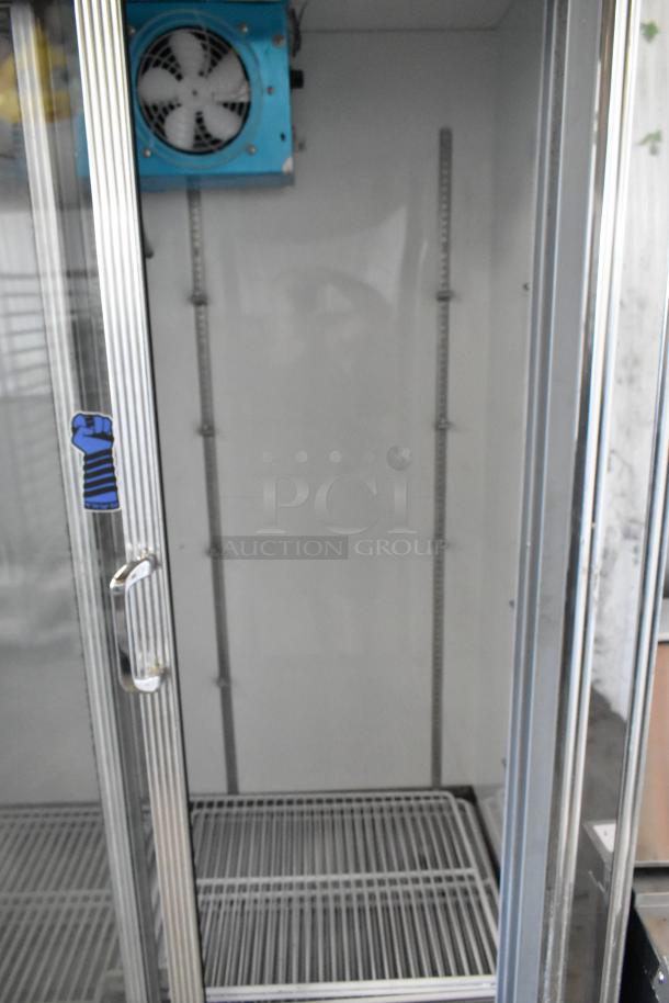 Universal Coolers 2-door reach-in cooler merchandiser, metal, 115 volts, 1 phase, excellent condition.