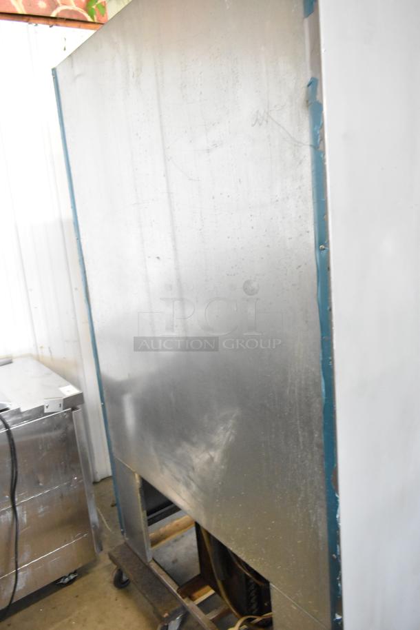 Universal Coolers metal commercial 2-door reach-in cooler. Used condition, 115 volts, 1 phase, no visible labels or tags.