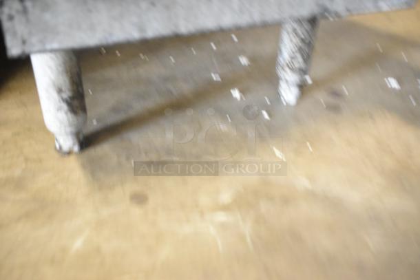 Blurry image of the Pitco Frialator 40C stainless steel deep fat fryer. Natural gas powered, 105,000 BTU. Floor style model.