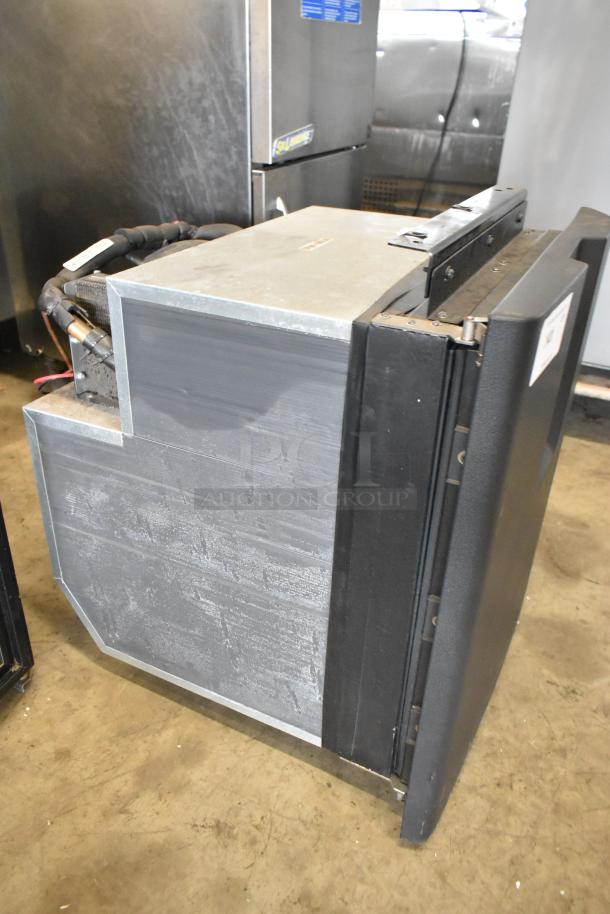 IndelB A22-73004-000 SP825 Mini Cooler, 12/24V DC, shown in used condition, features sturdy metal and plastic build.
