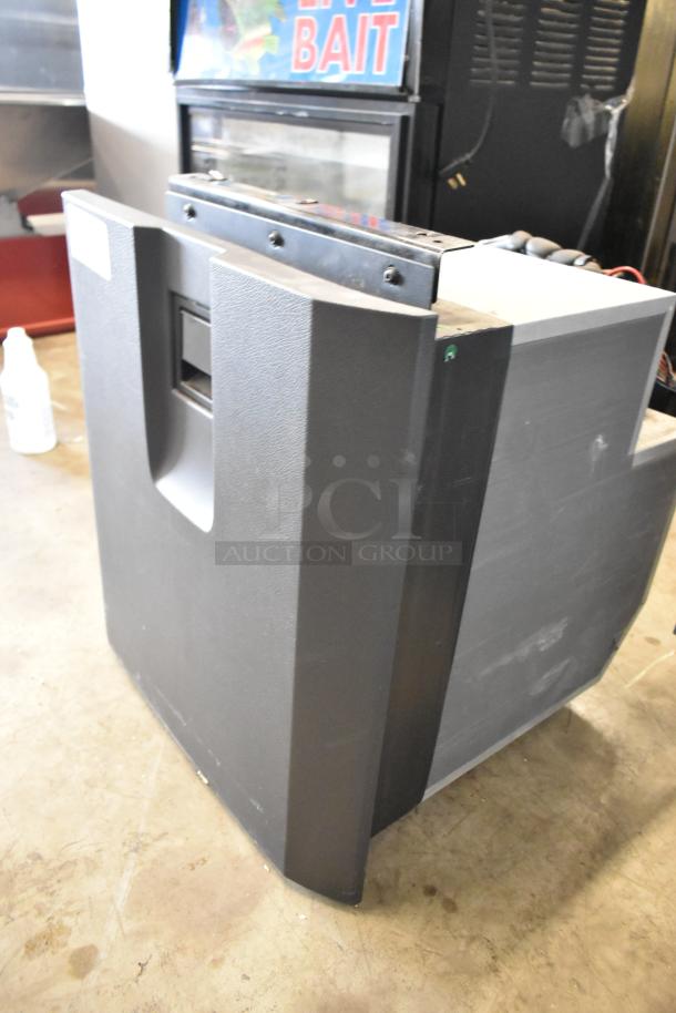 IndelB SP825 Mini Cooler, model A22-73004-000, 12/24V DC, in good condition. Black exterior, handle visible.