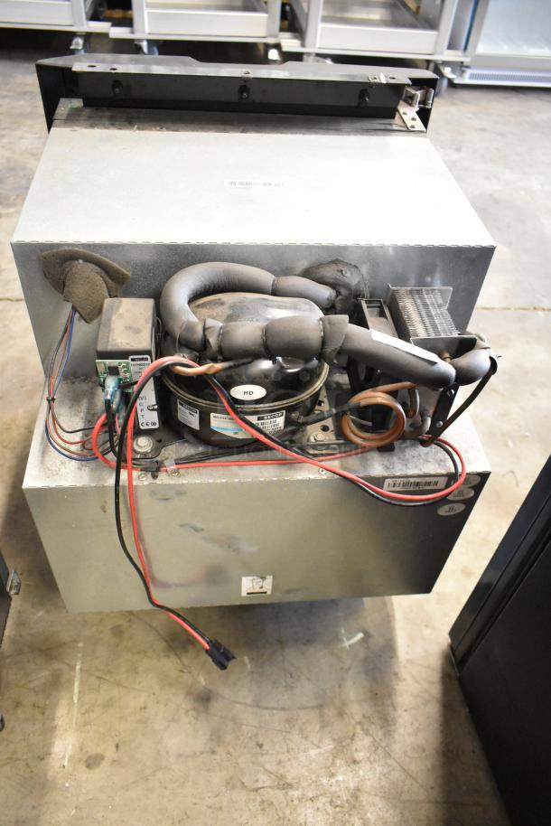 IndelB A22-73004-000 SP825 Mini Cooler, visible wiring and compressor. 12/24V DC, good condition, metal casing.