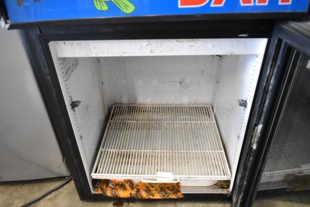 True GDM-05 Metal Mini Cooler Merchandiser, 115 volts, 1 phase. Interior shows wear and residue.