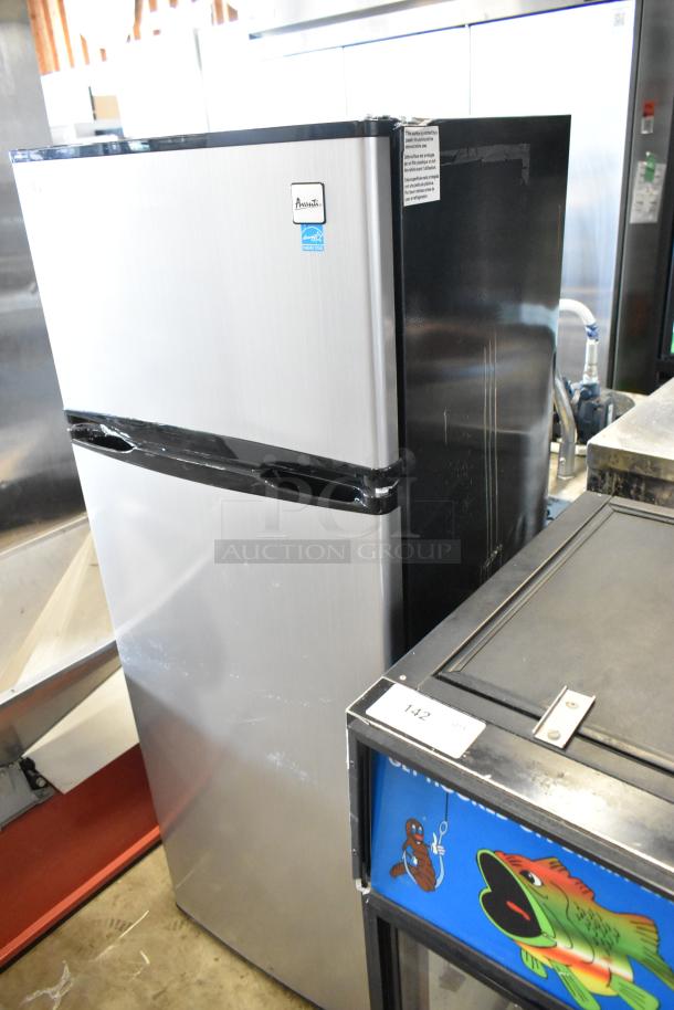Avanti chrome finish cooler with freezer, 115 volts, 1 phase, in good condition. Features dual compartments and branding label.