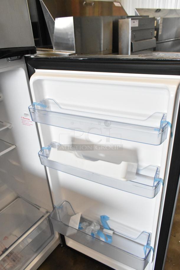 Avanti chrome finish cooler with freezer, 115 volts, 1 phase. Features adjustable shelves, door bins. Appears in excellent condition.