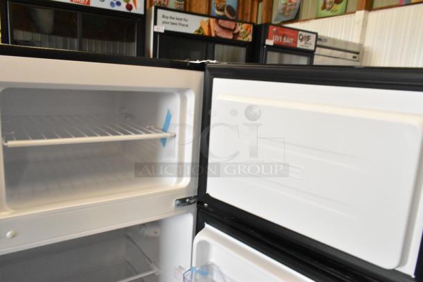 Avanti chrome finish cooler with freezer, 115 volts, 1 phase, open doors showing shelves and interior, in good condition.