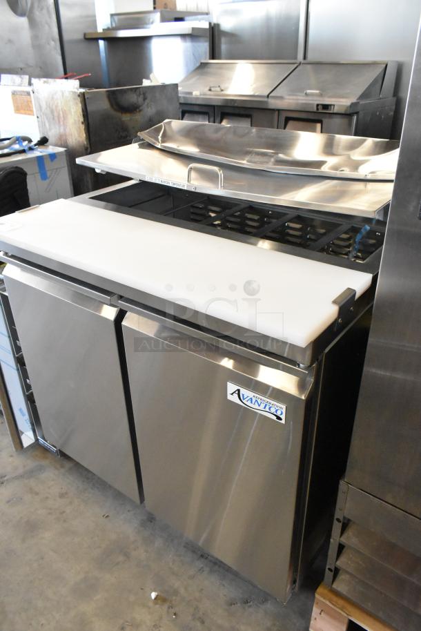 Brand new Avantco 178SSPT36HC stainless steel prep table, scratch and dent, with cutting board and mega top. Mounted on casters.
