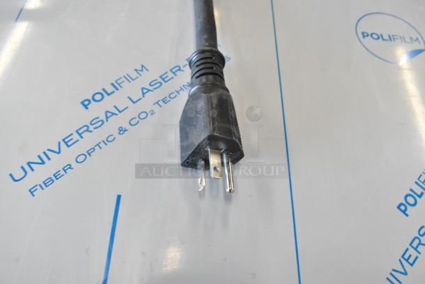 Close-up of a power plug on protective material for the Mainstreet 541HTUC30 high-temperature undercounter dishwasher.