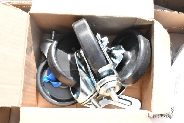 Box containing casters and hardware for True TSSU-72-30MB-ST-HC prep table. Items appear new and unused.