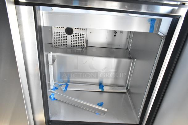 True TSSU-72-30MB-ST-HC stainless steel commercial sandwich salad prep table interior, showing scratch and dent condition.